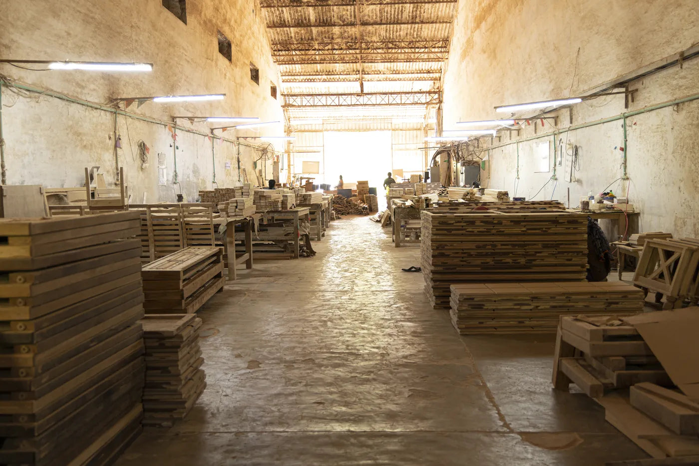 Rows of stacked timber in the workshop shed